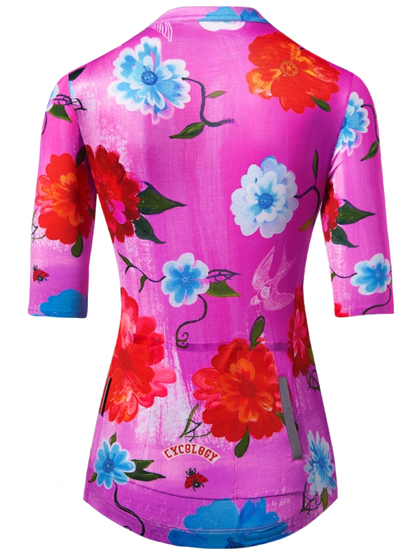 Floral-patterned women's cycling  jersey with colorful flowers on a pink background