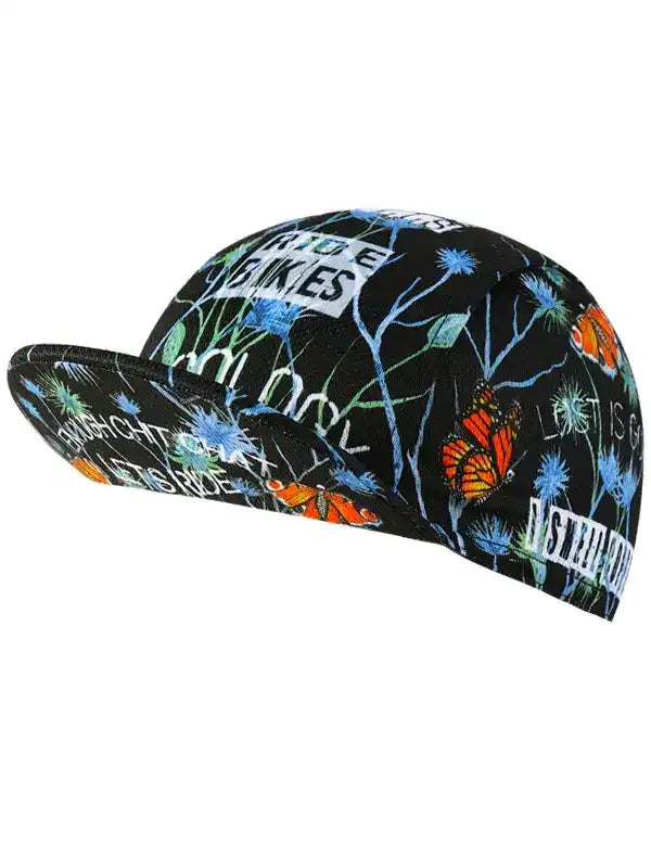 Black cycling cap with butterfly and floral print, featuring 'RIDE BIKES' text for men's and women's bike apparel.