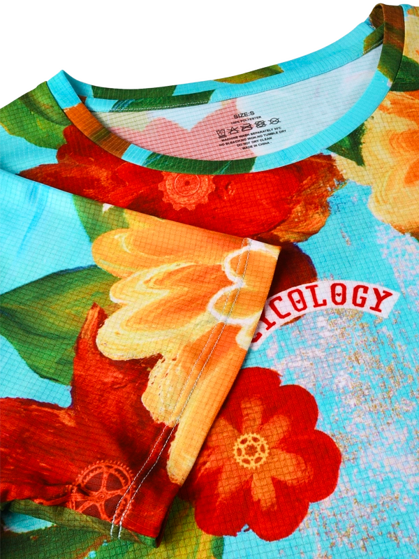 Close-up of a colorful floral-patterned T shirt with visible brand name.