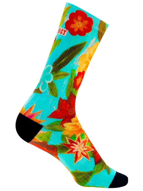 A single crew cycling sock with a vibrant, painterly floral pattern in turquoise, red, orange, yellow, and green, featuring solid black toe and heel sections.