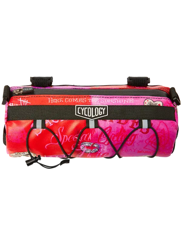 Pink and red bike bag with black straps 