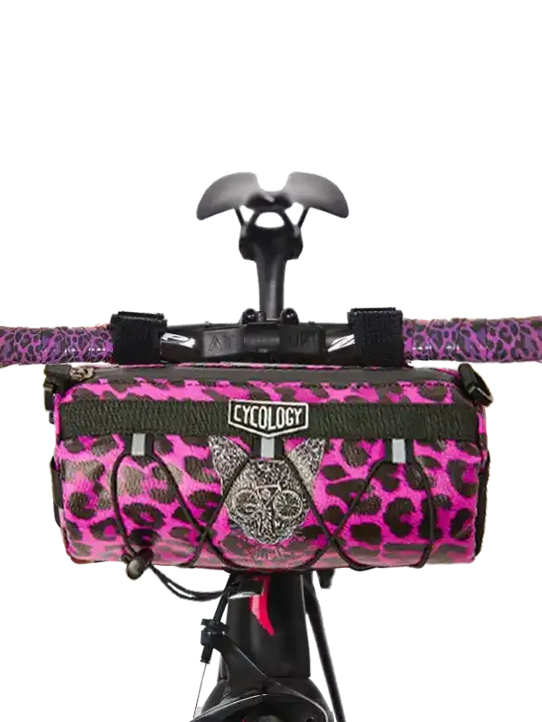Pink leopard print bike frame bag with Cycology logo, mounted on handlebars for cycling storage