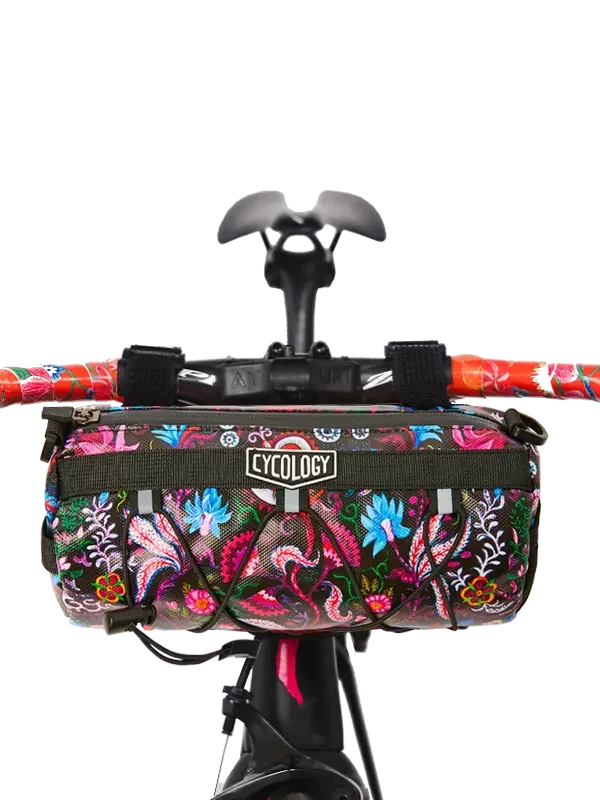 Colorful floral cycling handlebar bag with Cycology logo, perfect for bike adventures and gear storage.