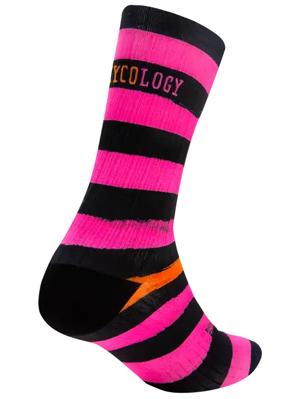 A single crew  cycling sock with bold horizontal stripes in hot pink and black, featuring a bright orange arrow design on the side, shown against a plain white background.