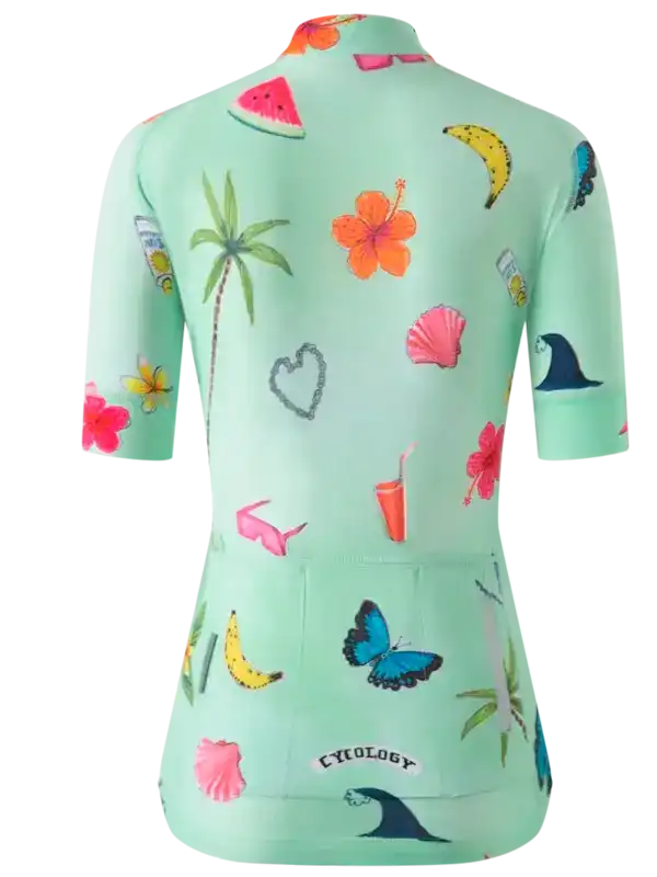 Women's mint green cycling jersey with tropical print, featuring palm trees, hibiscus, bananas, and butterflies for summer rides.