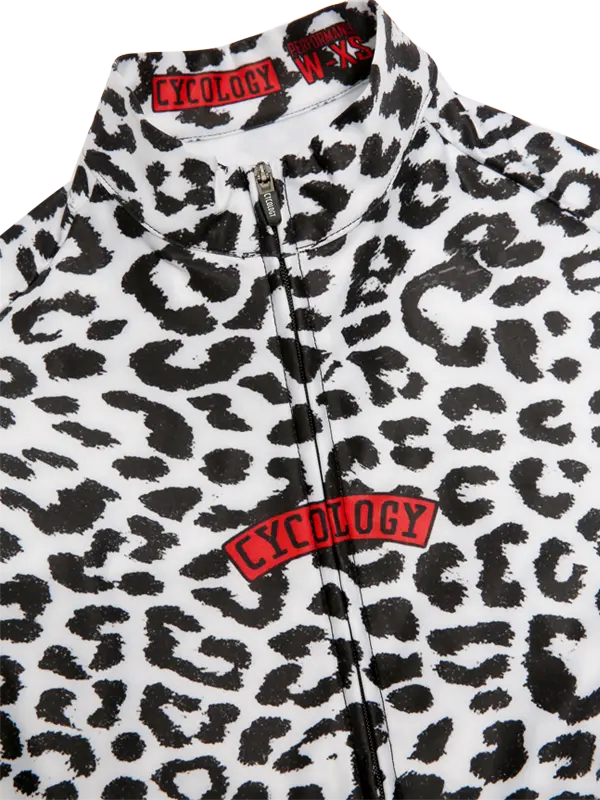 Kitty White Women's Winter Long Sleeve Cycling Jersey in Leopard print jacket with visible Cycology branding on a white background.