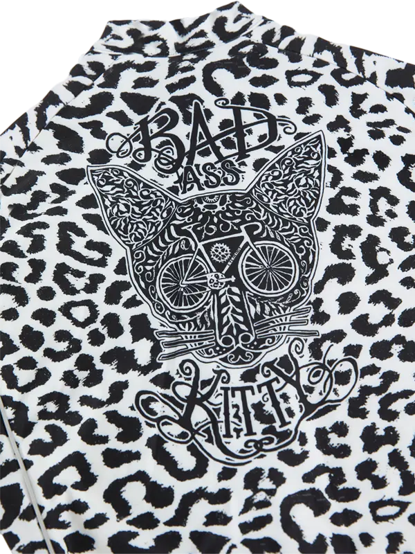 Kitty White Women's Winter Long Sleeve Cycling Jersey in Leopard print  with a graphic design of a cat skull and text on a white background