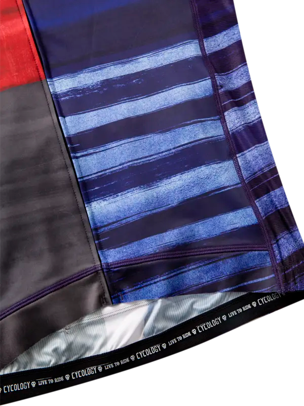 Close-up of  fabric with blue and black striped pattern, featuring the brand 'Cycology'.