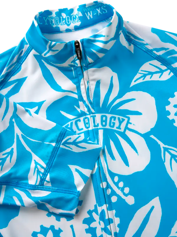 Blue cycling jersey with white Hawaiian floral pattern  with 'Cycology' branding.