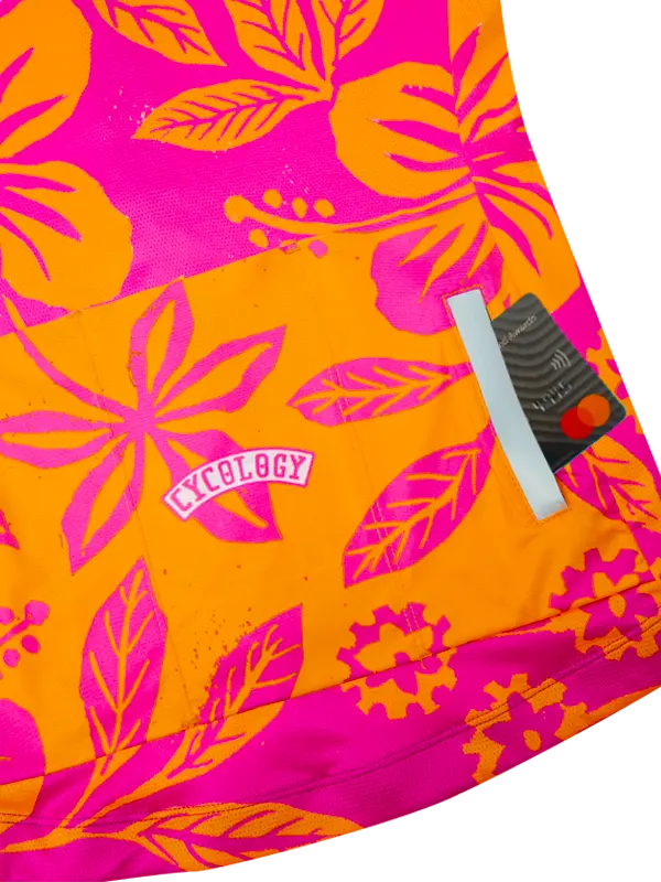 Bright pink and orange fabric with leaf pattern