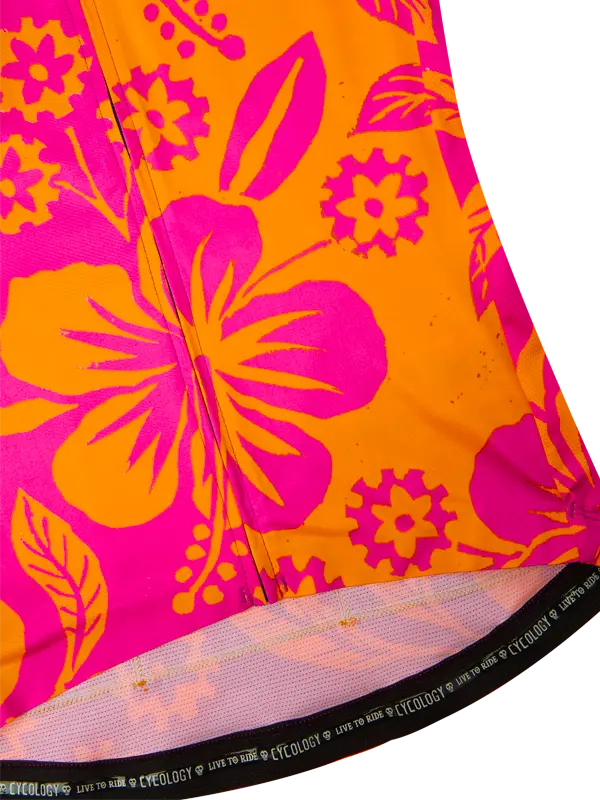 Close-up of a vibrant orange and pink floral patterned fabric