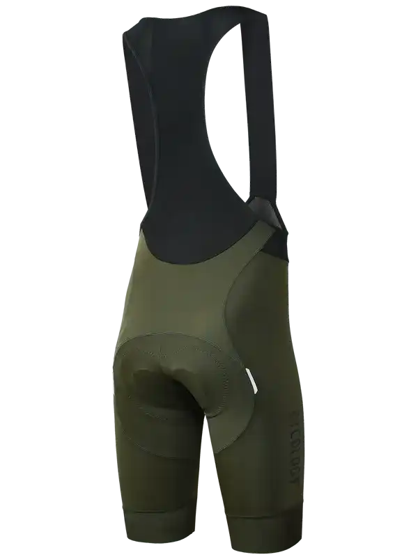 Rear view of A pair of men's cycling bib shorts in olive green with a black padded back panel and shoulder straps,
