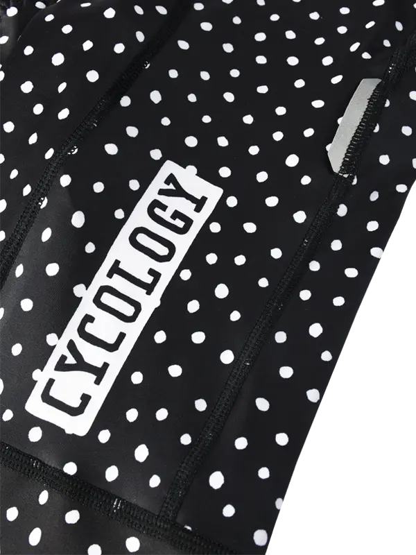 Black cycling bib shorts with white polka dot pattern  and 'Cycology' branding.