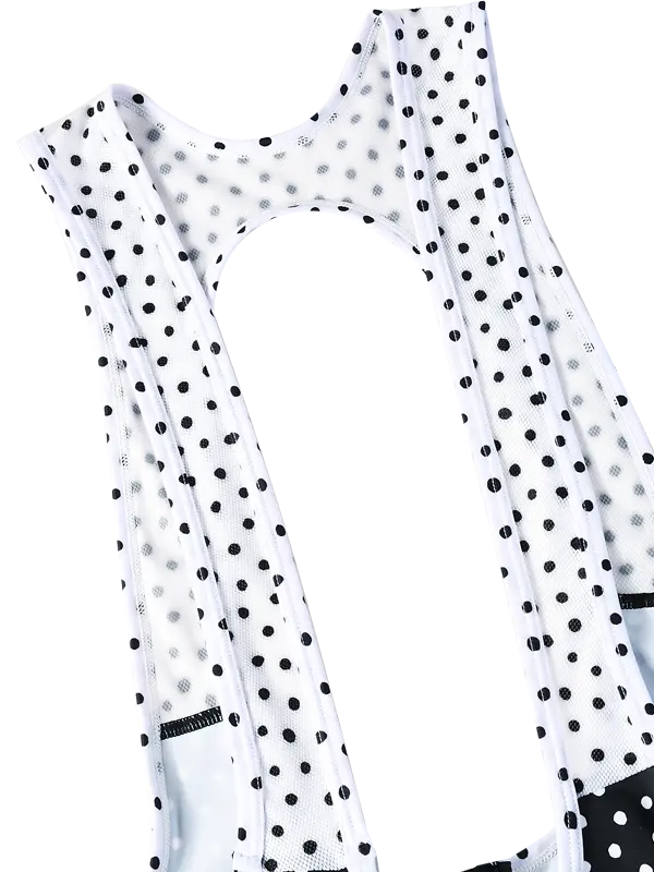 Black cycling bib shorts with white polka dot pattern - zip on back for quick stops