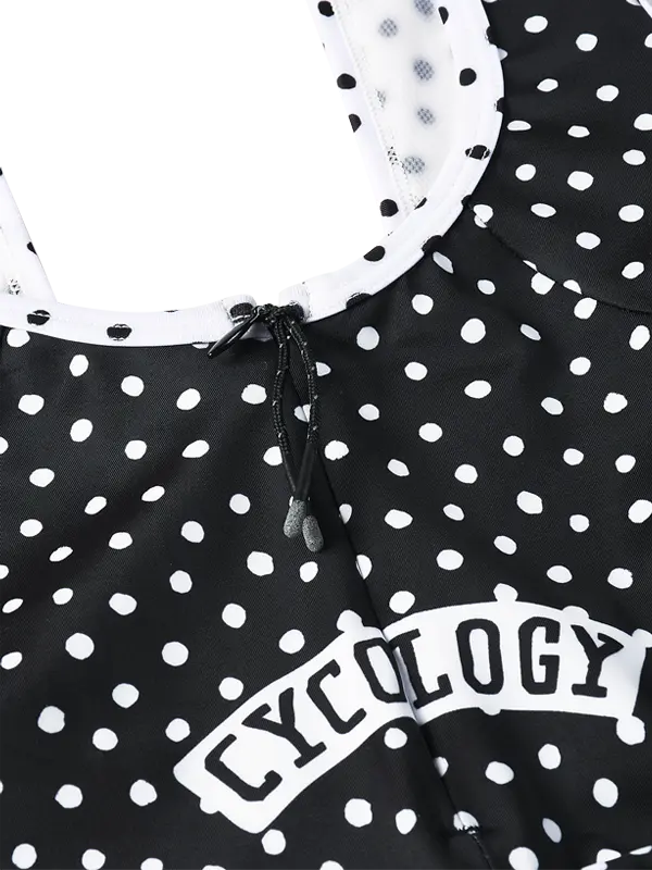 Black polka dot quick zip bib shorts with white trim and 'Cycology' branding.