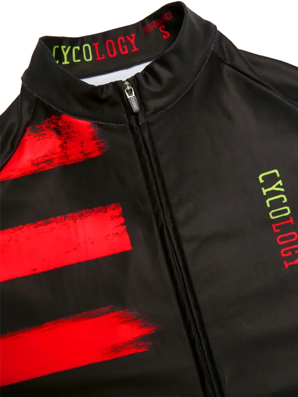 Maillot de cyclisme noir pour hommes avec accents rouges et marquage "CYCOLOGY".