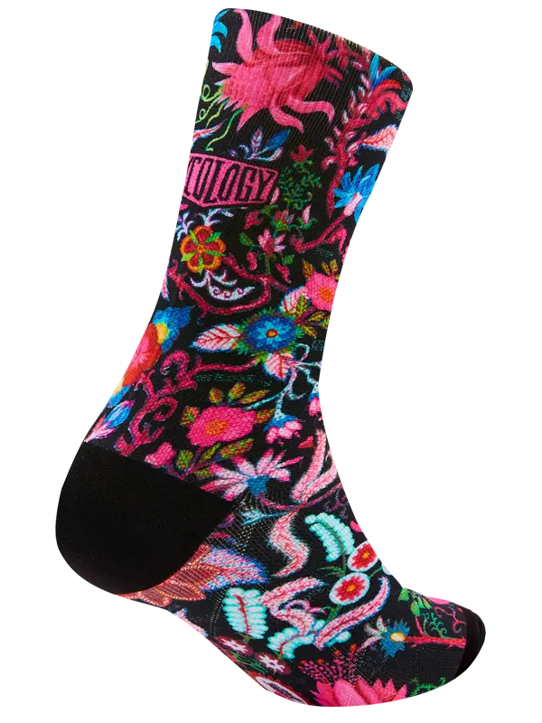 Colorful sock with floral and abstract designs on a white background