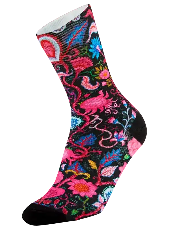 Colorful floral cycling sock with vibrant pink, blue, and green patterns on black background