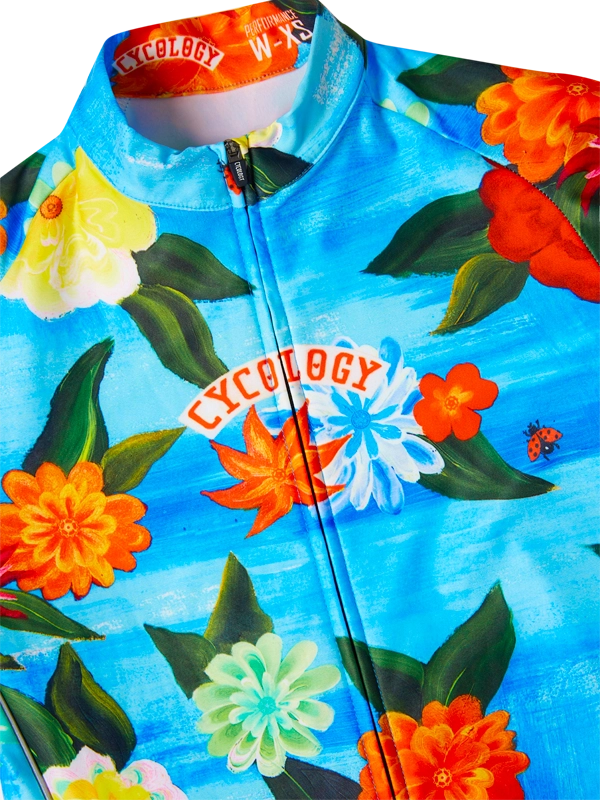 Floral-patterned jersey with 'Cycology' branding on a blue background
