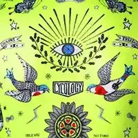 Vibrant green cycling jersey with tattoo-style eye, birds, and floral patterns for men and women