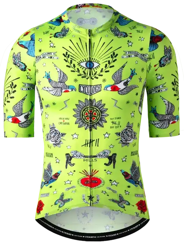 Vibrant green men's cycling jersey with tattoo-style birds, roses, and eye design, featuring full zip and brand logo.