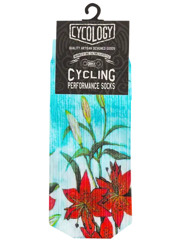A pair of cycling performance socks by Cylology, featuring a vibrant red lily floral print on a light blue and white textured background, packaged with a black cardboard header.