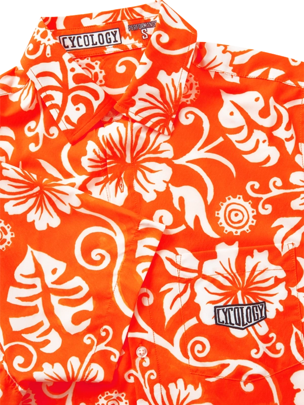 Orange and white floral patterned shirt with Cycology branding.