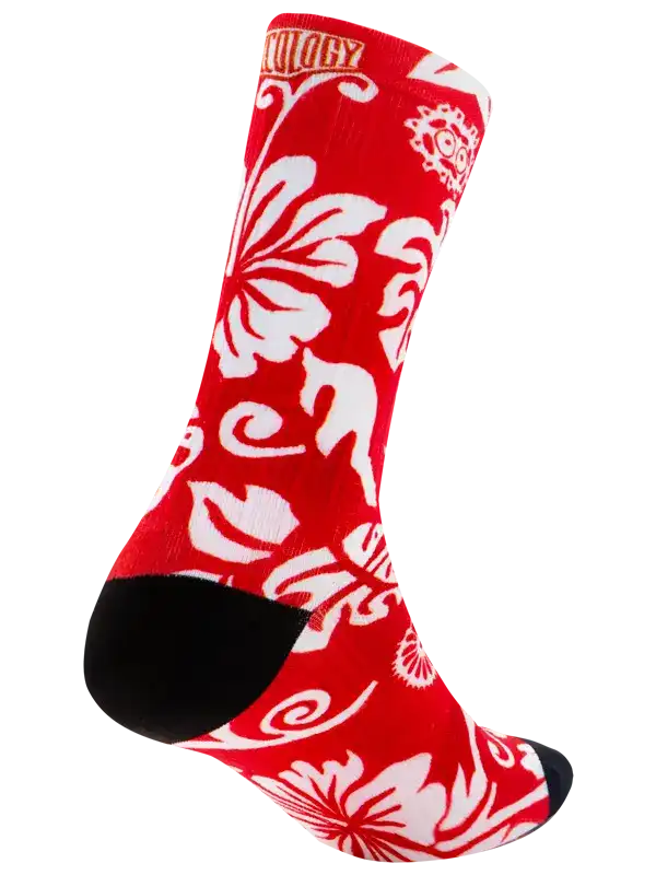 Red cycling sock with white floral pattern and black toe, designed for comfort and style on rides.