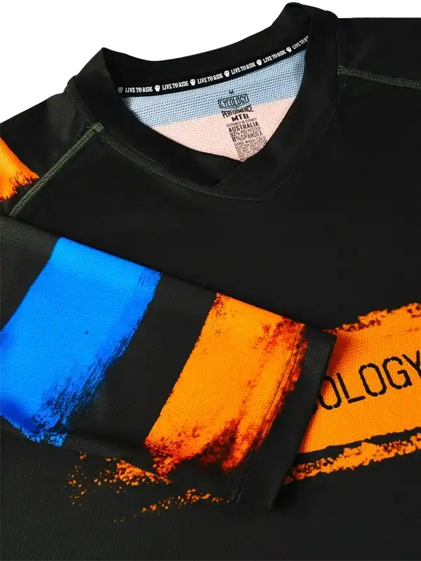 Men's black cycling jersey with bold blue and orange brushstroke design, performance fabric