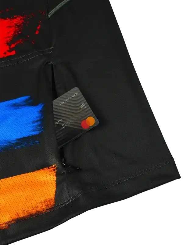 Black cycling jersey with red, blue, orange abstract print and secure card pocket detail