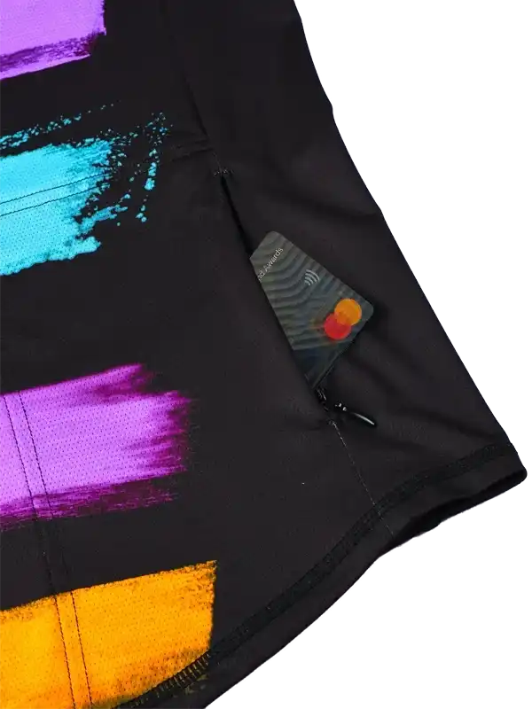 Black cycling shorts with colorful abstract print and secure zip pocket for essentials