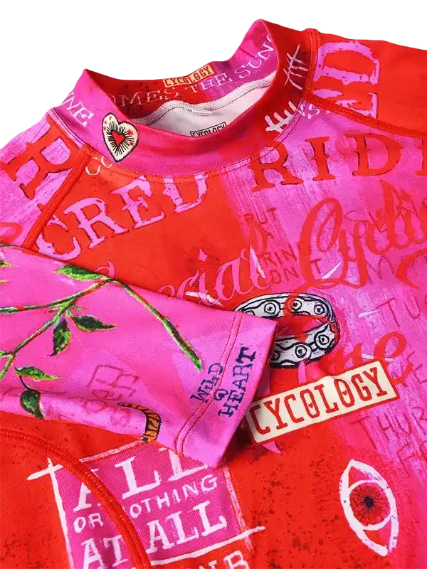 Vibrant pink and red cycling jersey with bold graphics and 'Cycology' branding, ideal for road rides.
