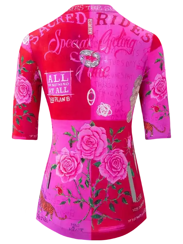 Women's cycling jersey with pink roses, tiger print, and motivational text on vibrant red and pink panels