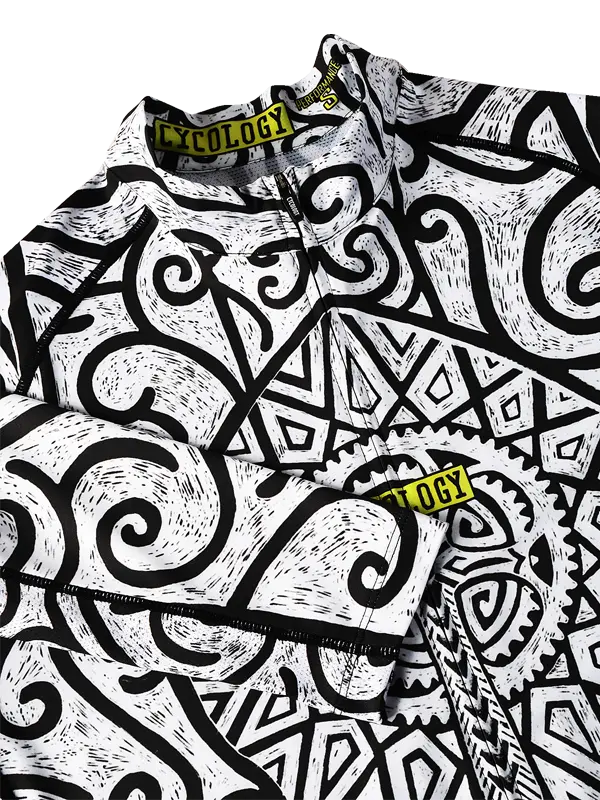 Close-up of a  Zanzibar Cycling jersey  with black and white geometric pattern and 'Cololgy' branding.