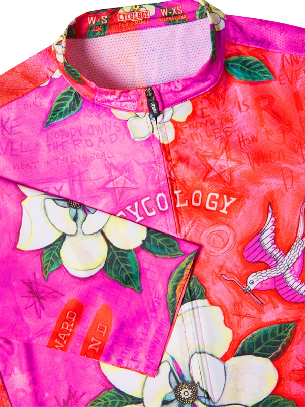 Women's pink cycling jersey with floral and bird design  