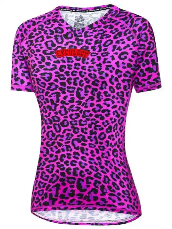 Women's pink leopard print cycling jersey with V-neck and brand logo, designed for performance and style.