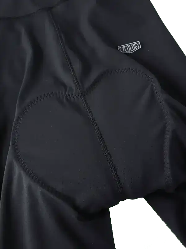 Black cycling shorts with padded seat and Cycology logo, designed for comfort and performance.