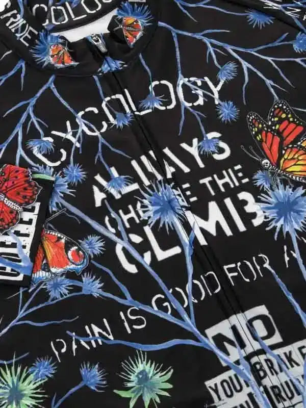 Black cycling jersey with butterfly and thistle print, motivational text 'Always Choose The Climb'