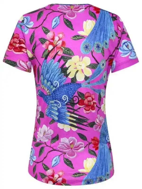 Vibrant pink women's cycling jersey with blue peacock and floral print, lightweight performance fabric