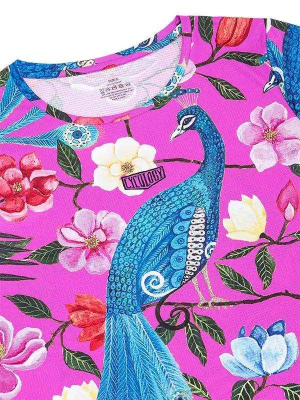Vibrant pink cycling jersey with blue peacock and floral print, featuring unique design details