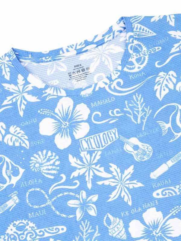 Blue cycling jersey with white tropical floral and Hawaiian-themed print, featuring hibiscus, ukulele, and island names