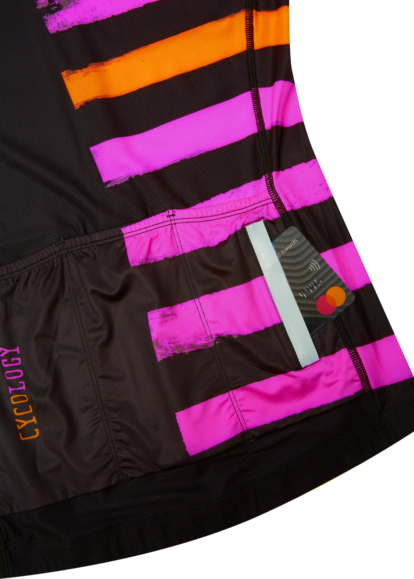 Close-up of a black, pink, and orange striped jersey with 'Cycology' branding.