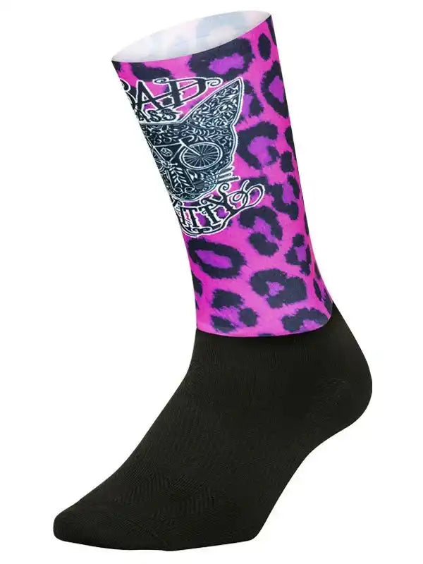 Pink leopard print cycling sock with skull and bike graphic, black toe and heel