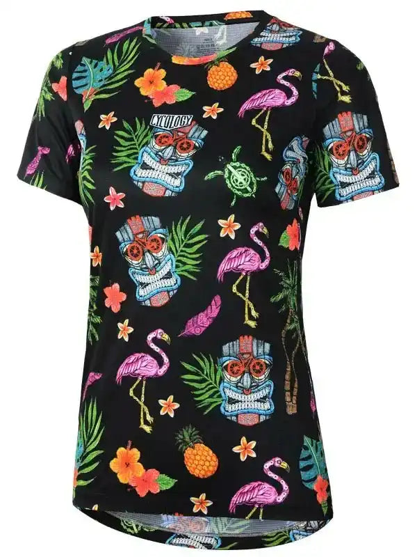 Women's tropical print cycling jersey with flamingos, tiki masks, and pineapples on black