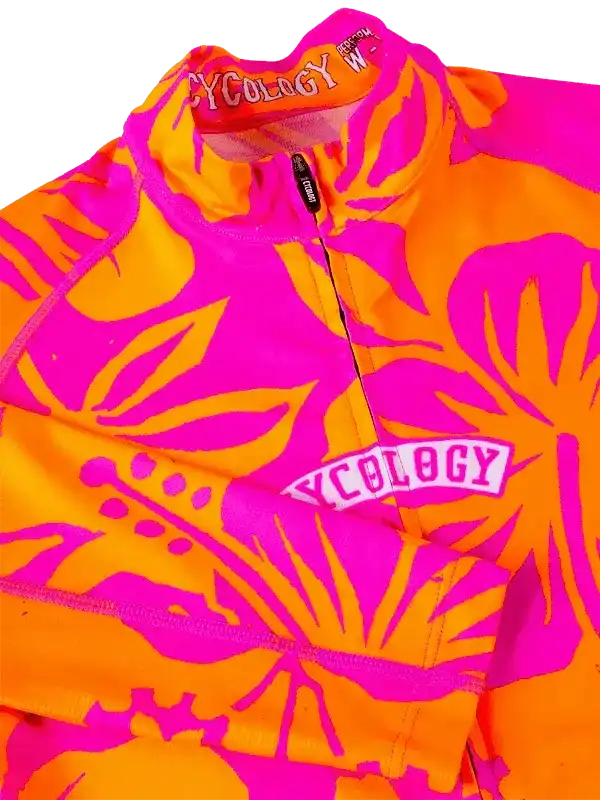 Vibrant pink and orange floral cycling jersey with bold design and zipper detail