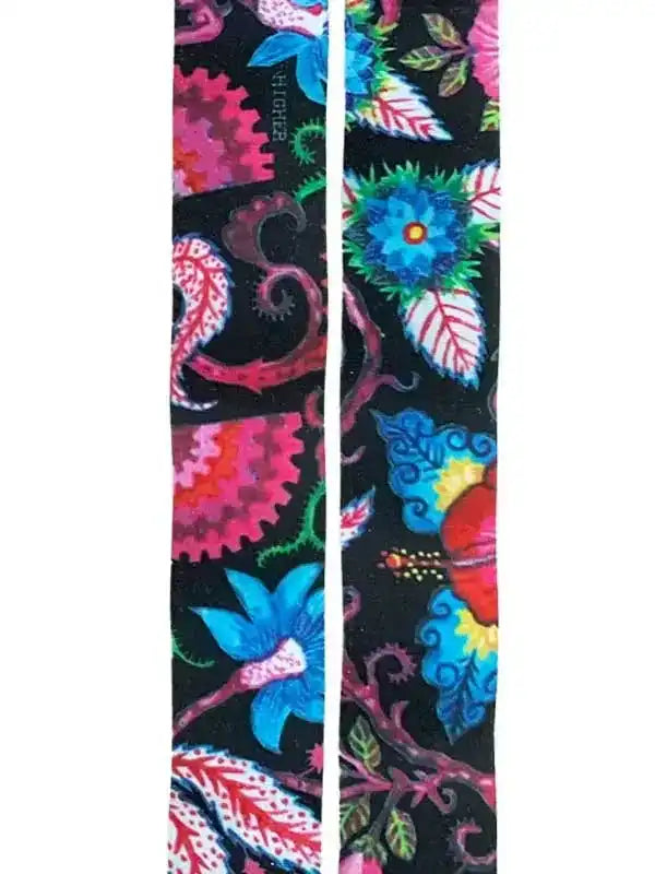Vibrant floral and gear pattern cycling socks on black background, perfect for bike rides