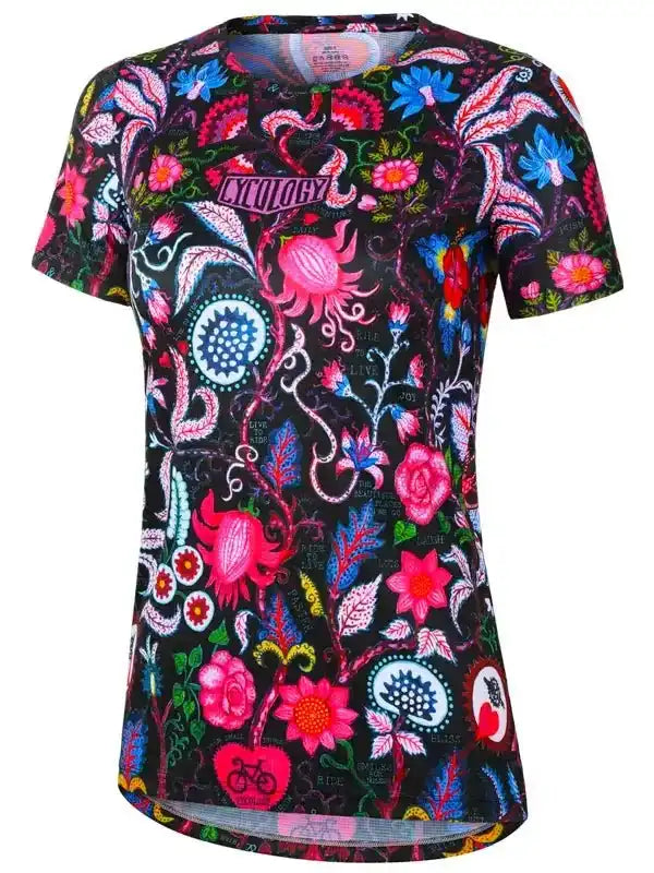Women's cycling jersey with vibrant floral and paisley print on black background, featuring bike motifs and 'CYCOLOGY' logo.