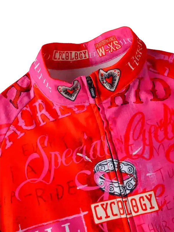 Women's pink and red cycling jersey with heart graphics and 'Cycology' branding, performance fit W-XS