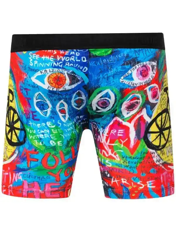 Colorful graffiti-style cycling shorts with bold eyes, text, and bike wheels design for men or women.