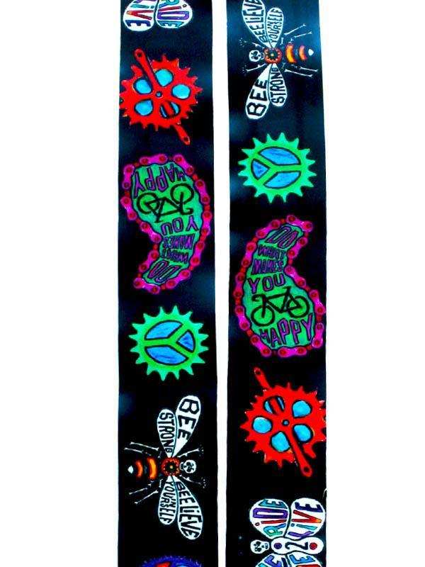 Vibrant cycling-themed socks with peace signs, bike gears, and motivational phrases for men and women